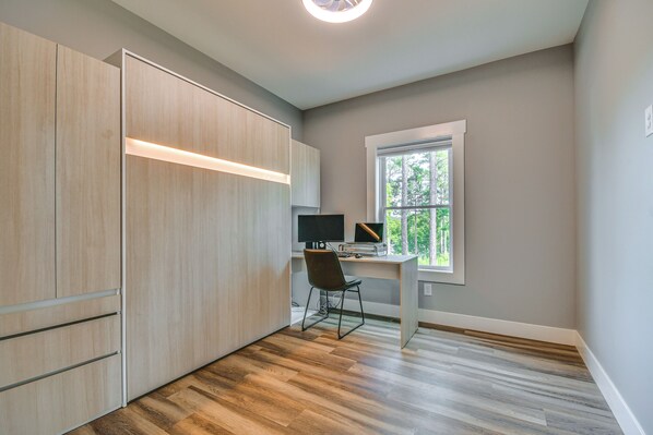 A modern room with a desk, computer, and storage cabinets. - Hot Tub + Game Room! Family Connelly Springs Home (Connellys Springs)