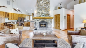 TV, fireplace, books - Home Near Glacier National Park w/ Hot Tub & Deck! (Columbia Falls)