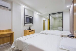 A hotel room with a bed, bedside table, TV, and a mirror. - Shenghao Hotel (Guangzhou Railway Station) (Guangzhou)