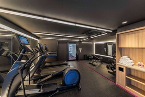 A modern gym with treadmills, elliptical machines, and free weights. - YOTEL Tokyo Ginza (Tokyo)