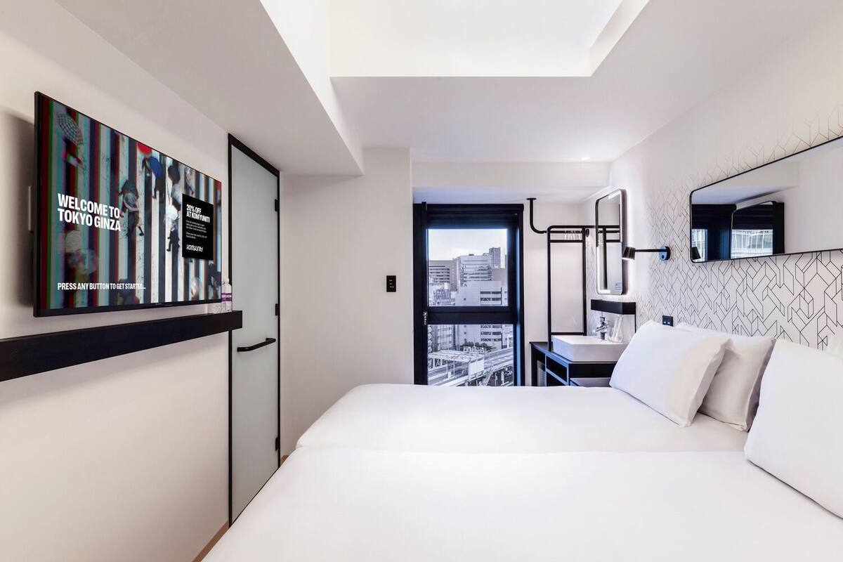 Standard Twin Room | In-room safe, desk, laptop workspace, blackout curtains