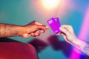 A hand holding a purple card with the text "Use to enter." - YOTEL Tokyo Ginza (Tokyo)