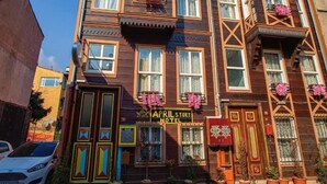 A multi-story building with a sign reading "APRIL STORY HOTEL". - April Story Apart Hotel (Istanbul)