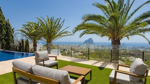 A poolside area with a view of a city and a mountain. - A021 - COLINA DEL SOL (Calpe)