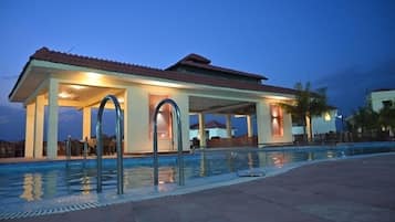 Outdoor pool, open 8:00 AM to 8:00 PM, pool umbrellas, pool loungers