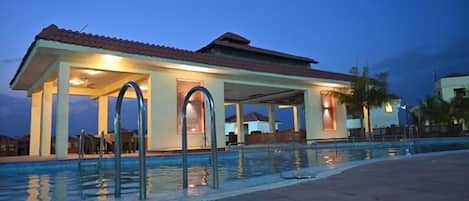 Outdoor pool, open 8:00 AM to 8:00 PM, pool umbrellas, sun loungers