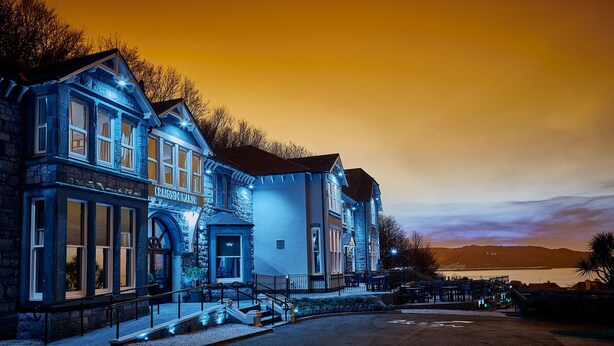 A historic building with a stone facade, large windows, and a prominent entrance. - Craigside Manor (Llandudno)