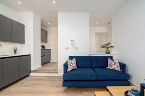 Deluxe Apartment, 3 Bedrooms, Non Smoking, Private Bathroom | Living area | 42-inch Smart TV with satellite channels