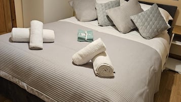 Departamento | 1 habitación, tabla de planchar con plancha, wifi gratis y ropa de cama