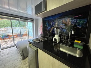 Studio, Courtyard View (Estudio Private Patio) | Private kitchen | Mini-fridge, microwave, cookware/dishes/utensils - Las Aguas Inner Experience (Bogotá)