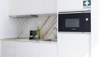 Fridge, microwave, stovetop, coffee/tea maker