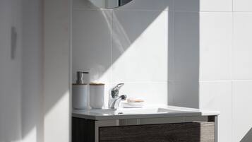 Eco-friendly toiletries, hair dryer, towels, soap