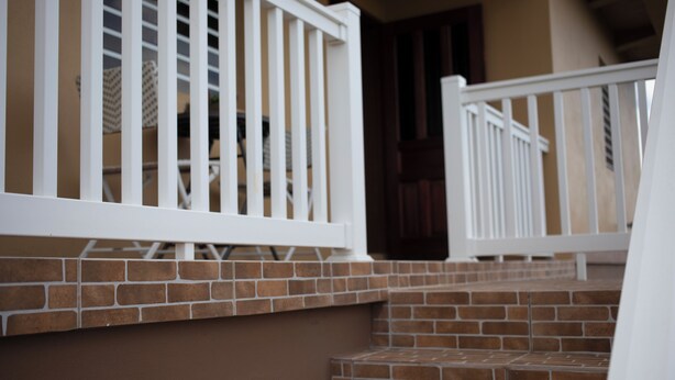 A set of brick steps with white railings leading to a door. - Modern Comfort: Private 1BR In Basseterre (Basseterre)