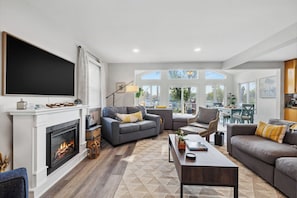Smart TV, fireplace, books, printers