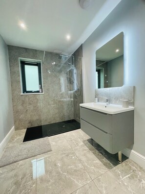 Shower, hair dryer, towels, soap