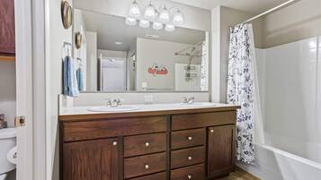 Shower, hair dryer, towels, shampoo