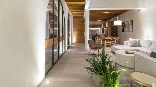 A modern interior with a kitchen, dining area, and seating space. - A Ndigo San Miguel (San Miguel de Allende)