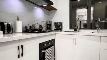 Deluxe Apartment, Balcony, Pool View | Private kitchen | Espresso maker, coffee/tea maker, electric kettle