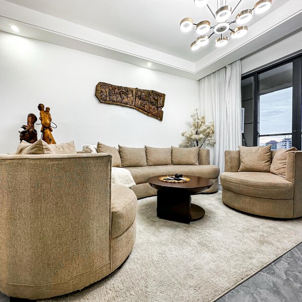 Deluxe Apartment, Balcony, Pool View | Living area | 55-inch plasma TV with digital channels, Netflix, streaming services