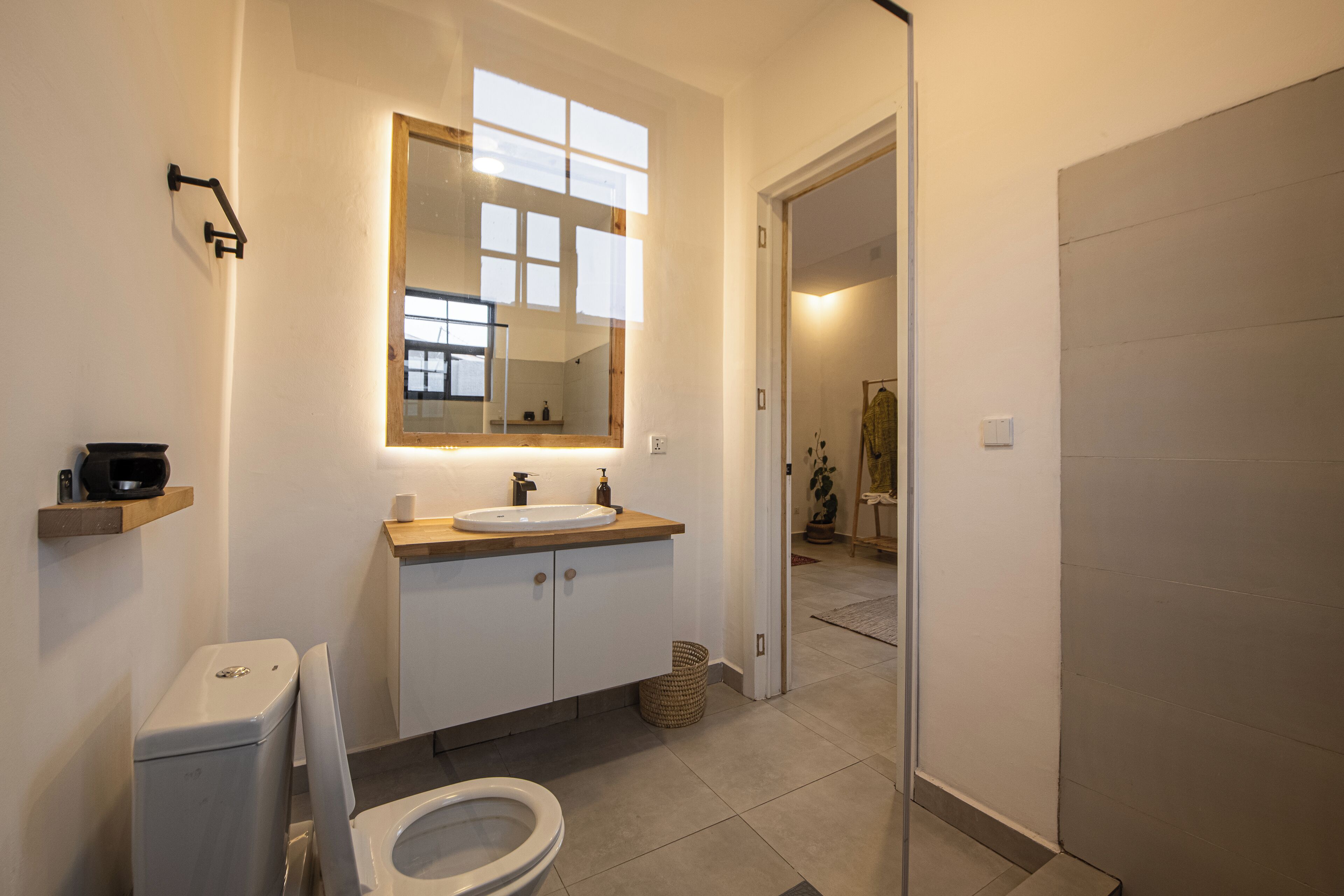 Shower, bathrobes, slippers, towels