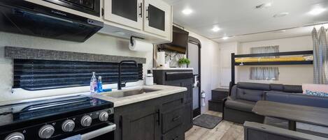 Fridge, microwave, stovetop, coffee/tea maker