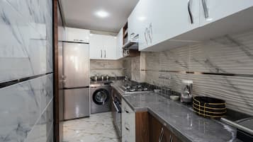 Deluxe Apartment, Balcony, City View | Private kitchen | Full-size fridge, microwave, oven, stovetop