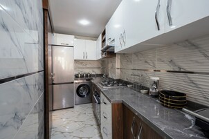 Deluxe Apartment, Balcony, City View | Private kitchen | Full-size fridge, microwave, oven, stovetop