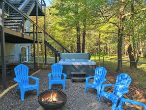 A patio with a fire pit, outdoor seating, and a hot tub. - CreeksideChalet LakeviewHOT TUB/GameRoom/FirePit/Kid Friendly - Pet Friendly  (Albrightsville)