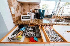 Fridge, coffee/tea maker, cookware/dishes/utensils