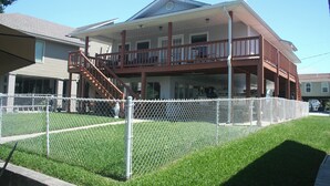 A two-story house with a balcony, a fenced yard, and a chimney. - Camp Gator #2 (Barataria)