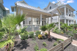 Relax in a tranquil garden setting with a covered outdoor area and stunning ocean views.