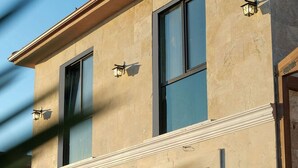 A two-story building with large windows and a flat roof. - The Kirte Hotel (Eceabat)