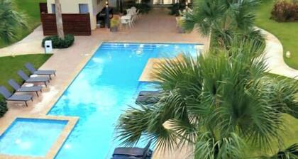 vr207h+c. Lovely apartment with pool view.