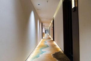A long hallway with a unique floor design.