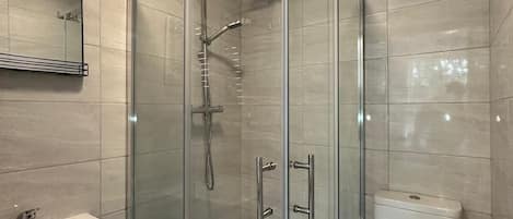Shower, eco-friendly toiletries, towels, soap