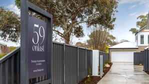 A gated property with a sign indicating '59 onlast Boutique Accommodation 1 to 4 beds.' - Central Studio in new townhouse! (Beechworth)