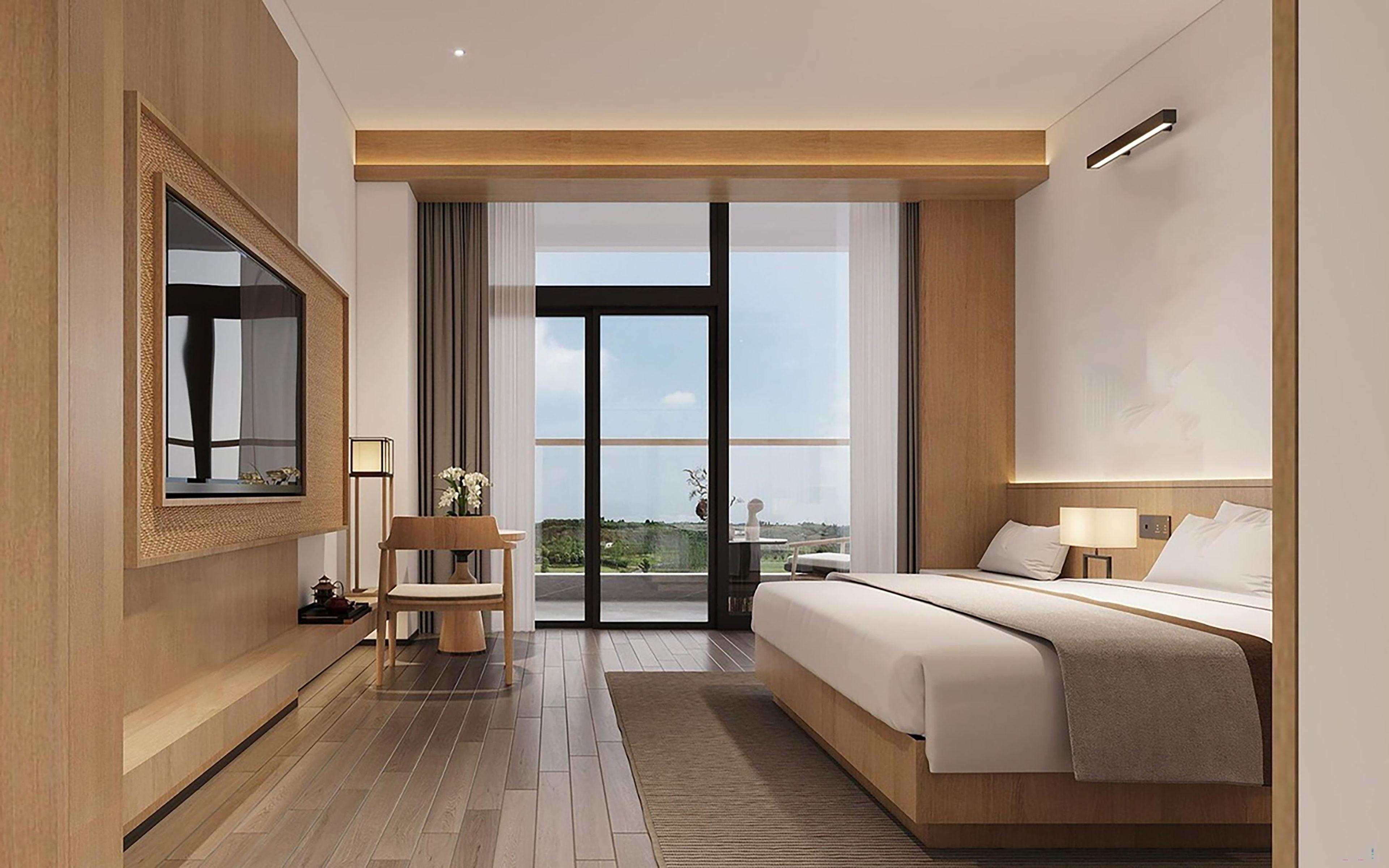 Habitación de hotel moderna con una cama grande, televisión, zona de estar y vistas a través de un ventanal.