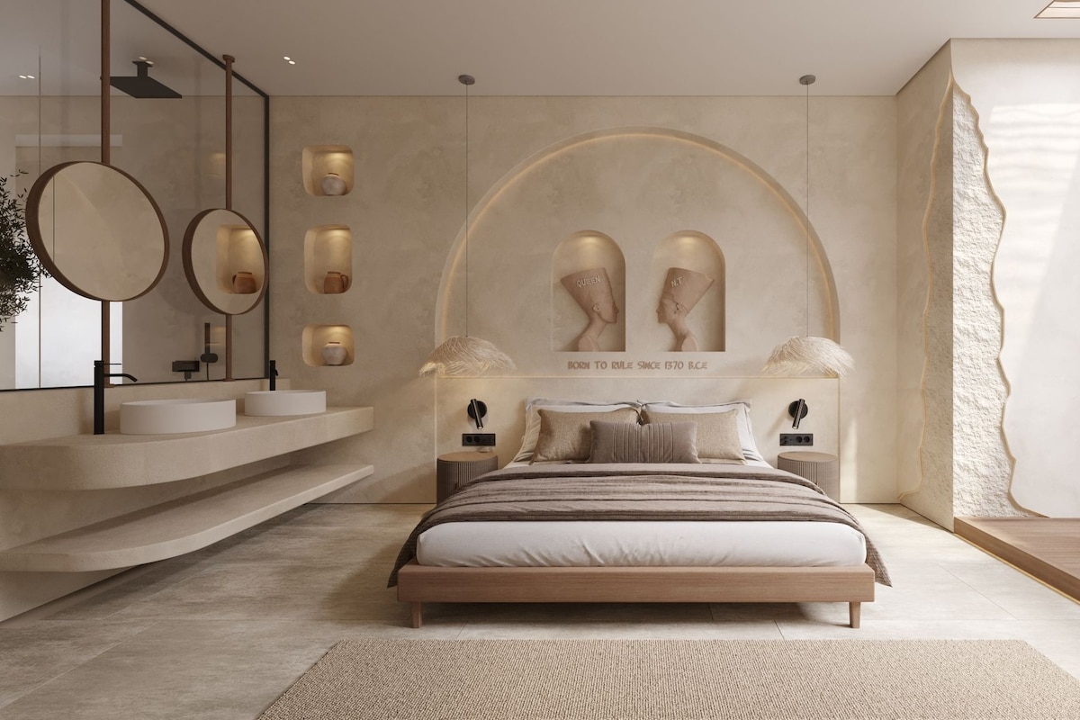 Un dormitorio moderno con una cama grande, un tocador empotrado y una obra de arte única en la pared.
