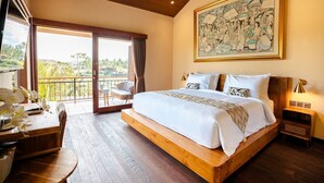 A spacious bedroom with a large bed, a balcony with a view, and a painting on the wall. - Kari Senja Luxury Villa  (Mas)