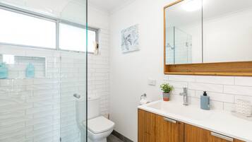 Shower, hair dryer, towels, soap