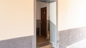 A doorway leading to a room with a door marked '2' and a vase on the floor. - GuestHost - Affori FN Modern Apartment x4! (Milano)