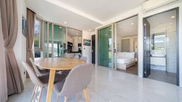 Premium Apartment, 2 Bedrooms, Balcony, Partial Sea View | Living area | Flat-screen TV