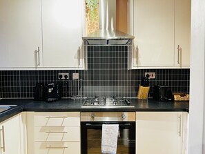 Fridge, microwave, oven, stovetop - Irene Suite By Koya Homes (Cardiff)
