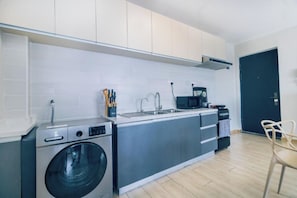 Microwave - Studio Apartment by Away Homes Rentals (Syokimau)