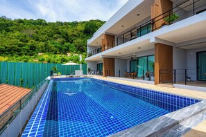 A modern two-story house with a swimming pool. - Hillside Seaview Residence (Karon)