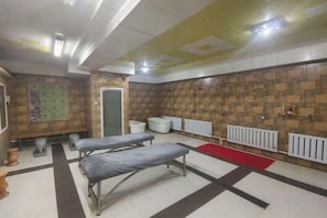 A room with two beds, a radiator, a white sink, and a red carpet. - Suifenhe Jixing Hotel (Suifenhe)