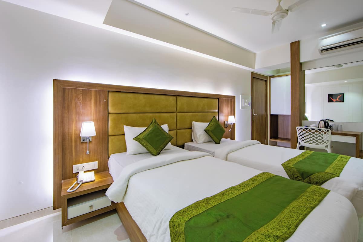 Chambre Deluxe, vue sur la ville | 1 chambre, systĂšme dâinsonorisation, fer et planche Ă repasser
