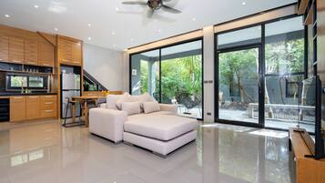 Exclusive Villa, 1 Bedroom, Garden View | Living area | Flat-screen TV