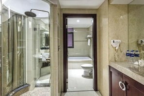 A modern bathroom with a glass-enclosed shower, a toilet, and a vanity with a mirror and towel rack. - Fujun Meicheng Hotel (Suzhou)