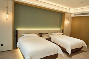 A hotel room with two beds, a large wall panel, and a modern design. - Yujingyuan Hotel (Taoyuan)